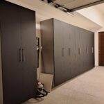 a room with black cabinets and a vacuum